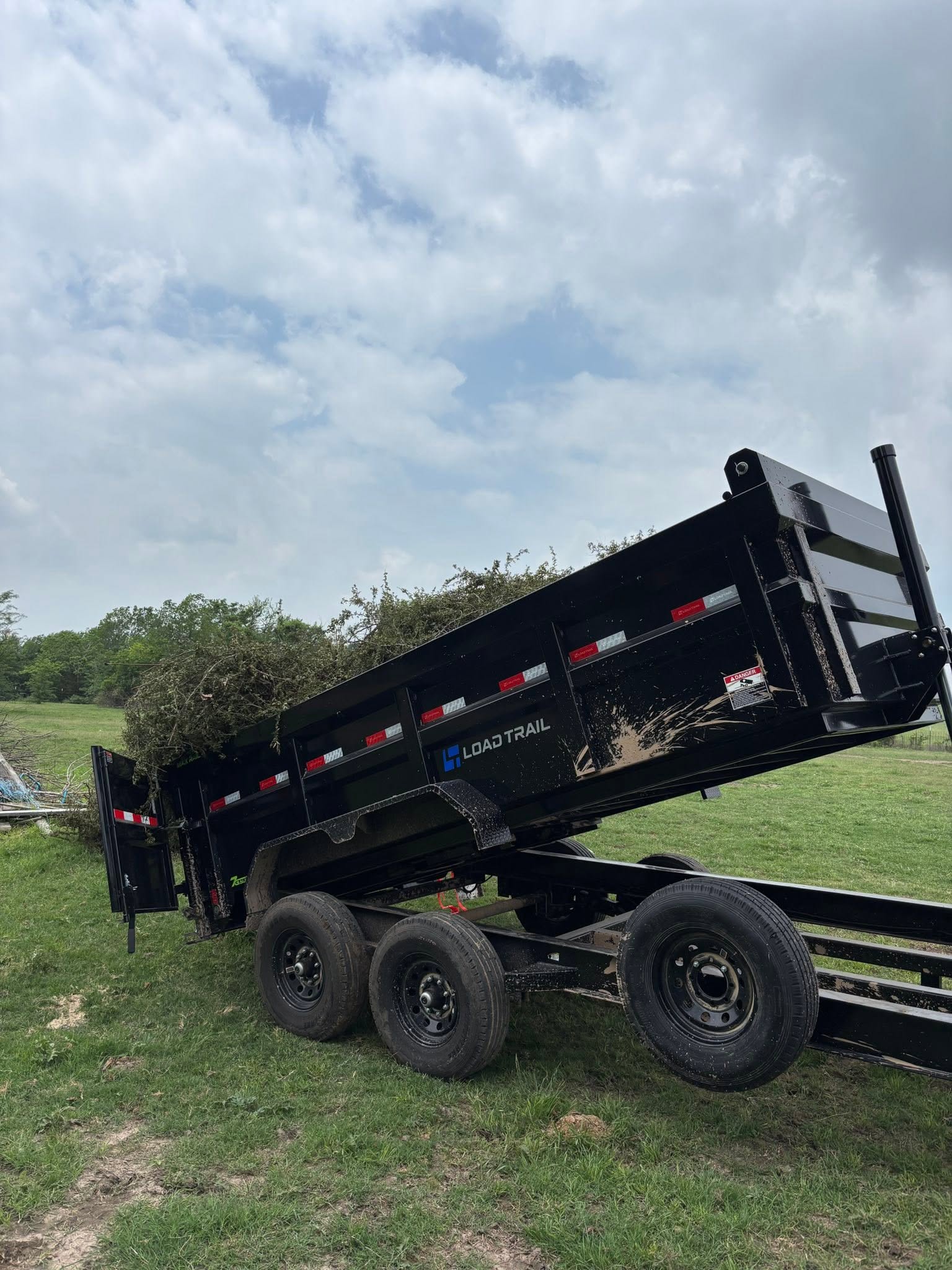 Load Trail dump trailer raised for unloading